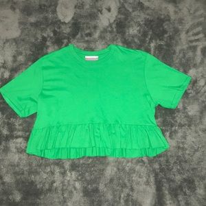 Green crop top with ruffles at bottom